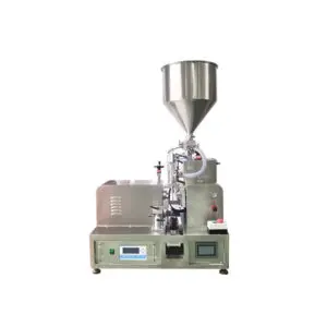 Tube filling and sealing machine with hopper